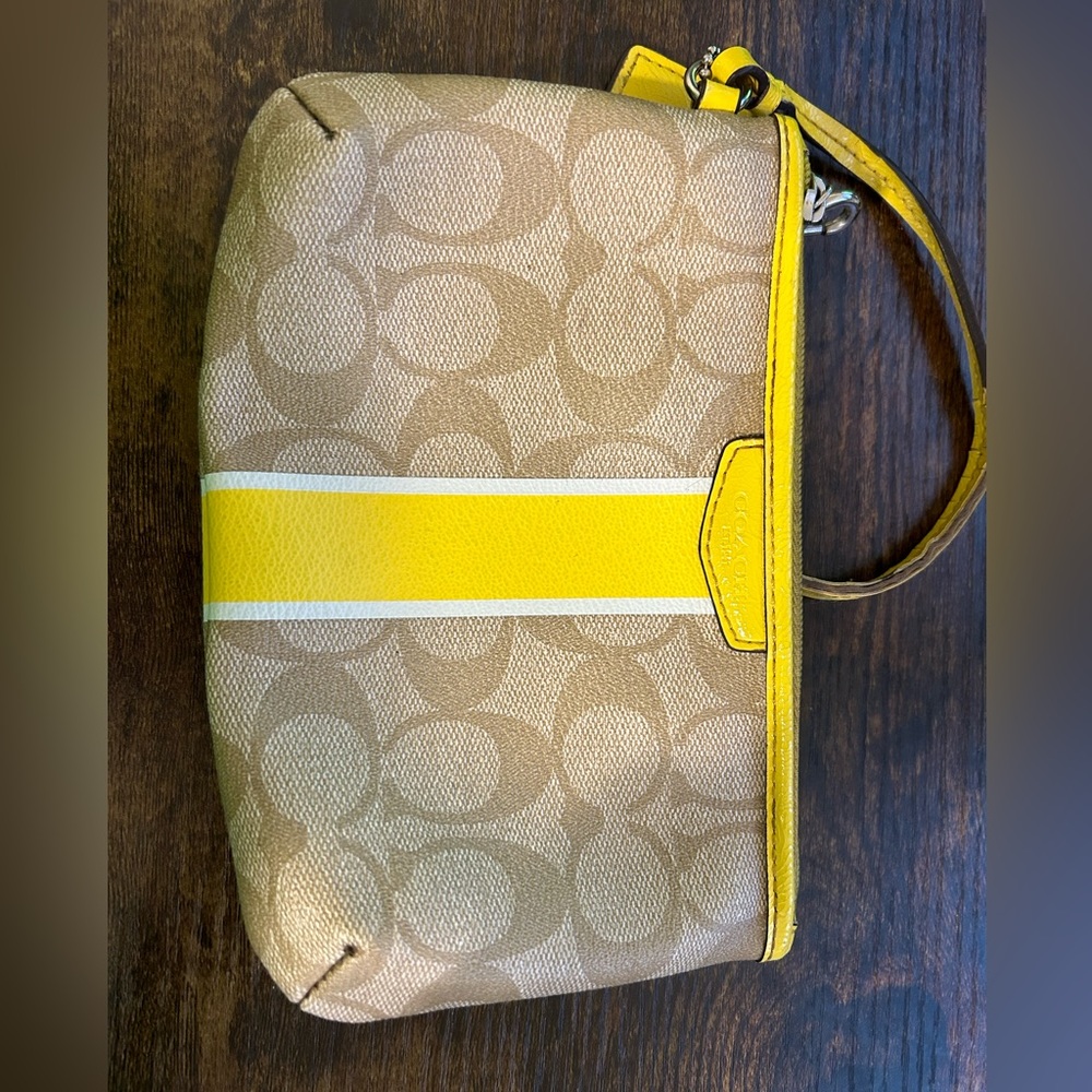 Yellow and bray coach wristlet